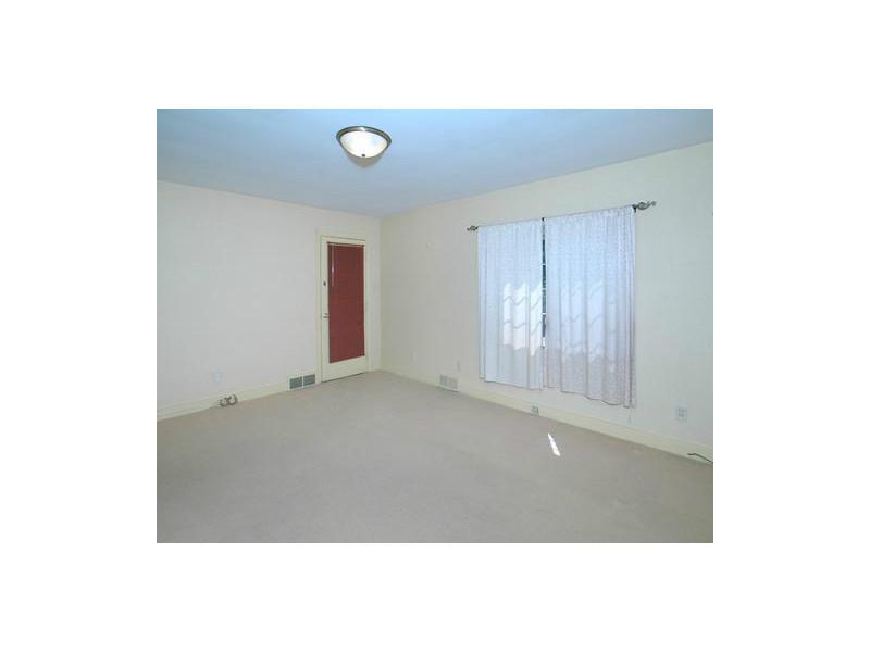 Family Room. This first floor family room features a large closet to hold all your games, puzzles, and other items for a fun family gathering.  There is also an updated half-bath, and the door in the corner leads to the deck and backyard.