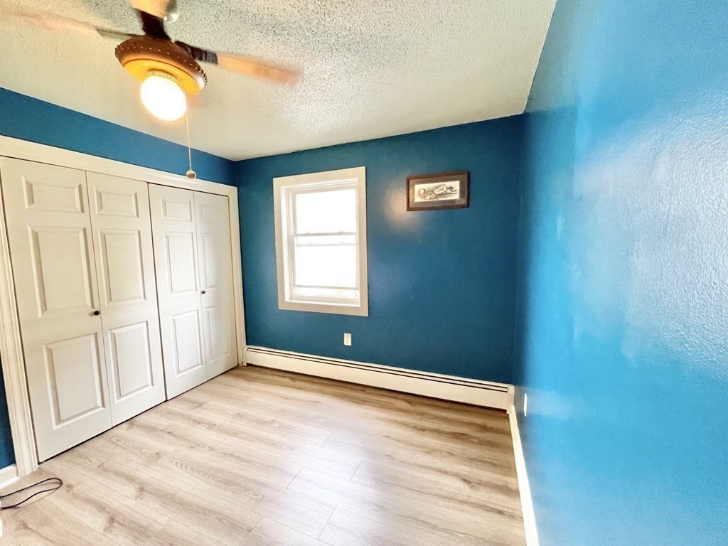 1107 James Street, Unit 1107 Chicopee, MA 01022 - Photo 14 of 26 a view of an empty room with window and stairs