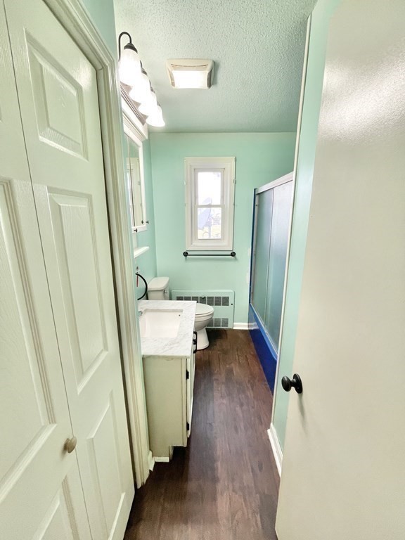 1107 James Street, Unit 1107 Chicopee, MA 01022 - Photo 20 of 26 a bathroom with a sink a toilet and a mirror