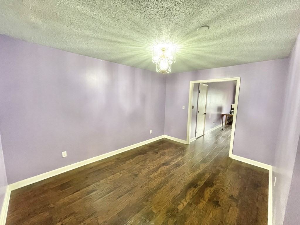 1107 James Street, Unit 1107 Chicopee, MA 01022 - Photo 4 of 26 a view of an empty room and window