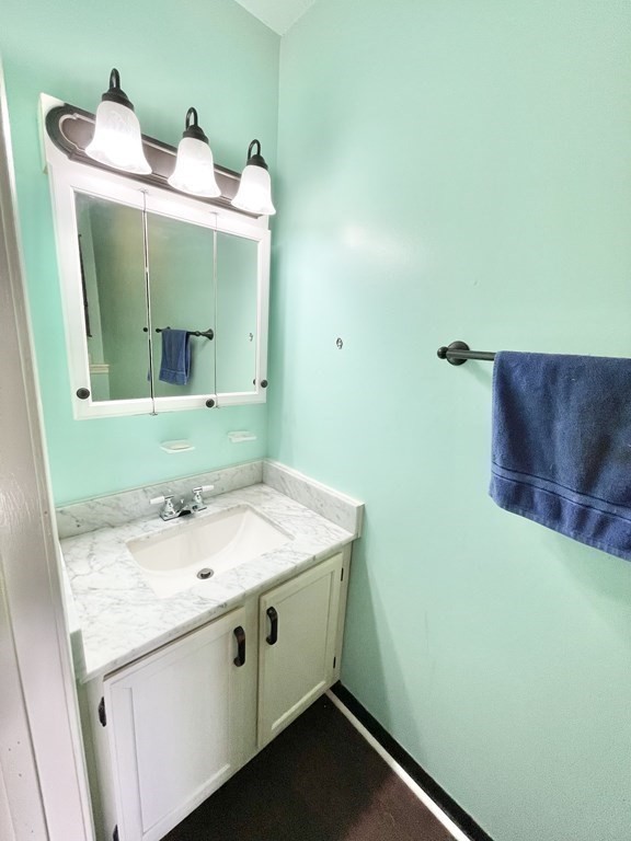 1107 James Street, Unit 1107 Chicopee, MA 01022 - Photo 6 of 26 a bathroom with a sink and a mirror