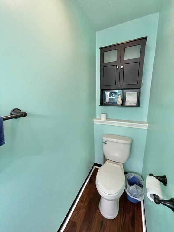 1107 James Street, Unit 1107 Chicopee, MA 01022 - Photo 7 of 26 a bathroom with a toilet and a mirror