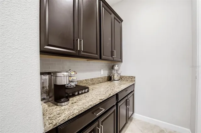 a view of a swimming pool with outdoor seating