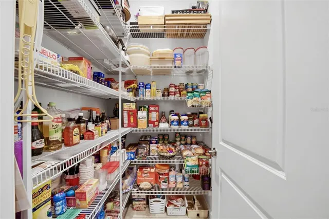 a view of a lake with a table and chairs