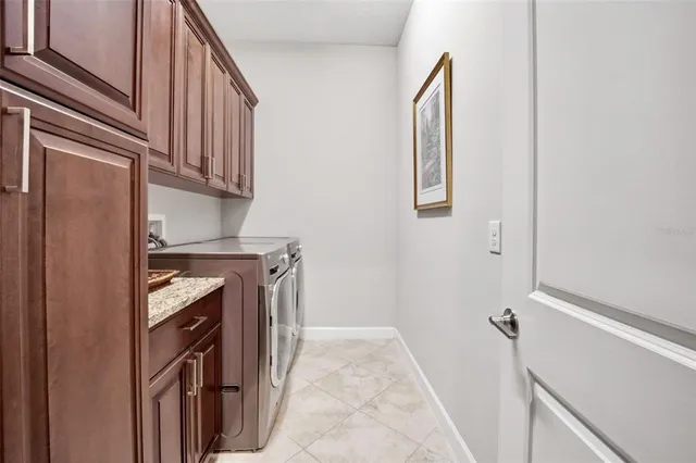 a view of a dining room with a table and chairs