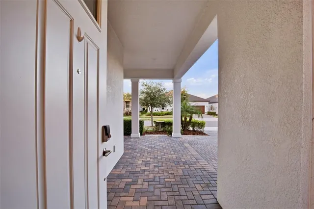 a large kitchen with stainless steel appliances a stove a sink and a refrigerator