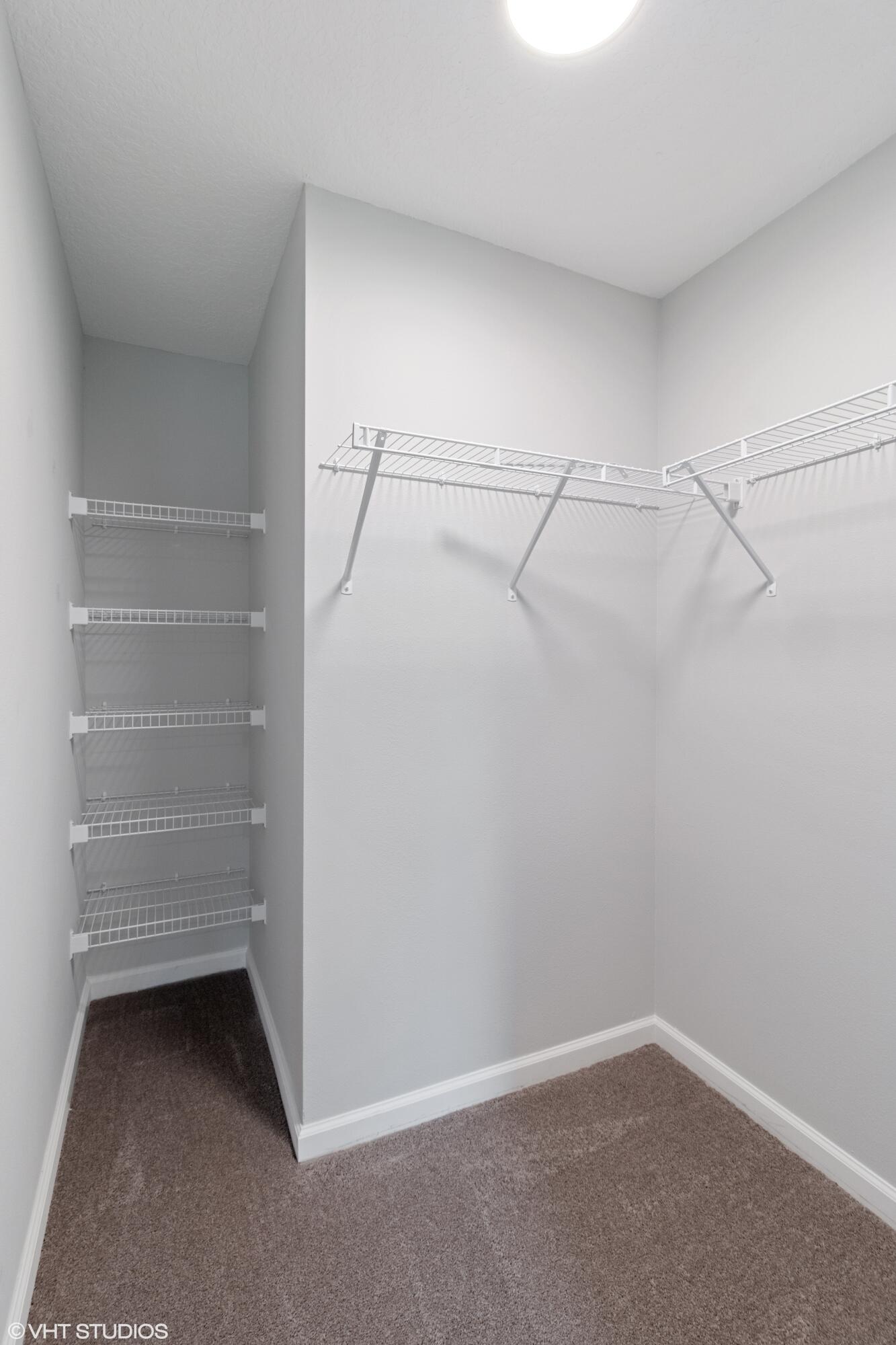 4910 Southeast Jack Avenue Stuart, FL 34997 - Photo 11 of 14 a view of an empty walk in closet