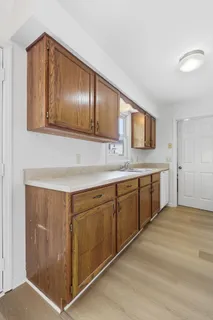 a kitchen with stainless steel appliances granite countertop a sink and cabinets