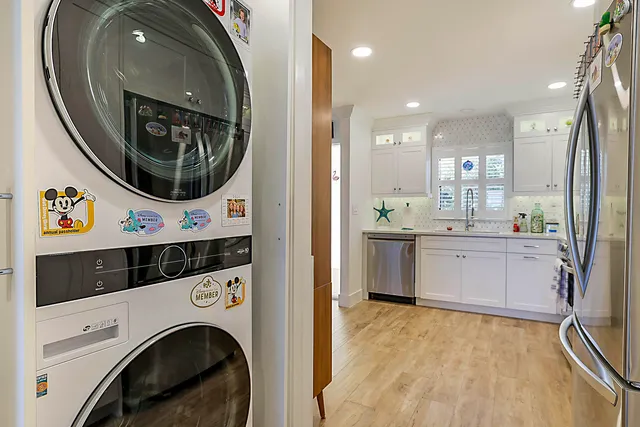 a view of a kitchen with a washer and dryer