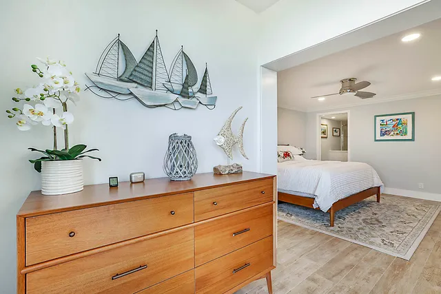 a bedroom with a bed and dresser