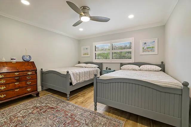 a bed room with a bed and a window