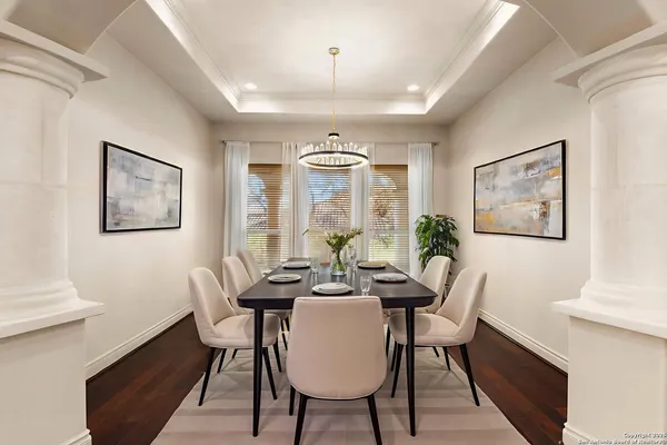 a view of a dining room with furniture window and wooden floor