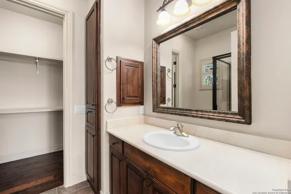 a bathroom with a sink and a mirror