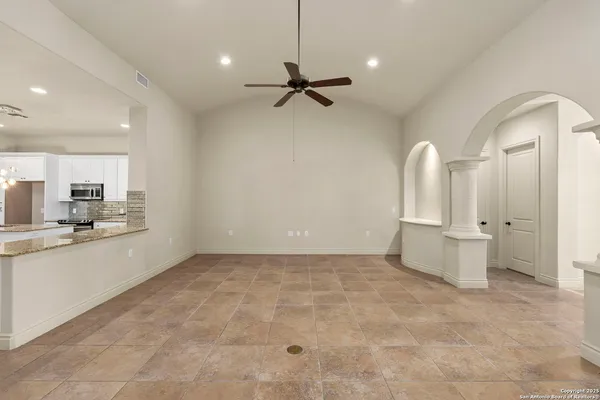a view of a kitchen with a sink and cabinets