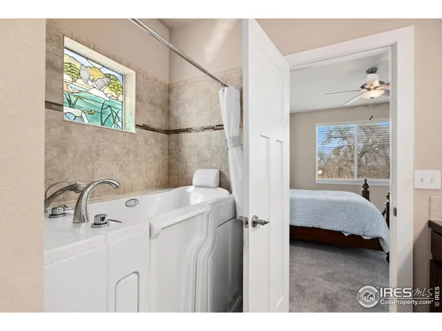 a bathroom with a sink a mirror and a shower