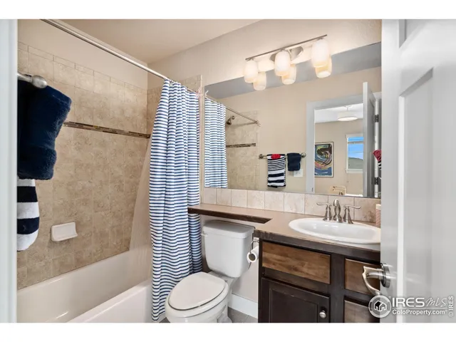 a view of entryway with a lots of frames on wall