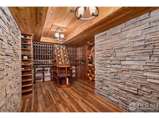 a kitchen with stainless steel appliances a dining table chairs and a refrigerator