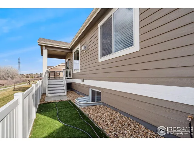 a view of a fence and a yard