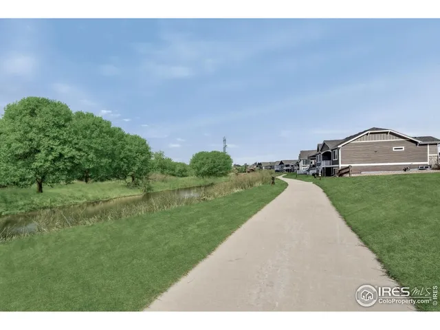 a view of a lake with a yard