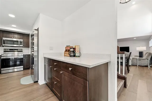 a white toilet sitting next to a shower curtain