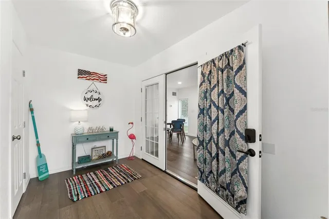 a view of a dining room with furniture and wooden floor