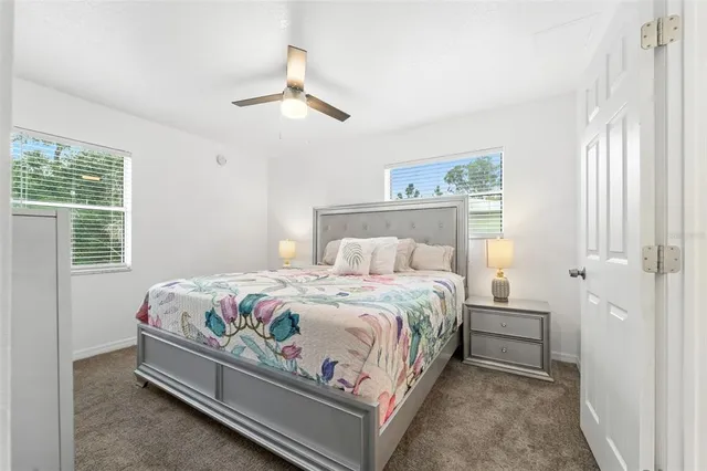 a bedroom with a bed and a television