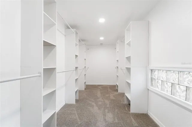 a en suite bathroom with a sink and a window