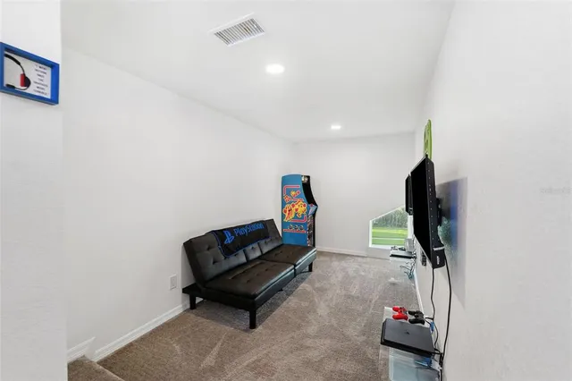 a view of a vase of flowers sitting on a table