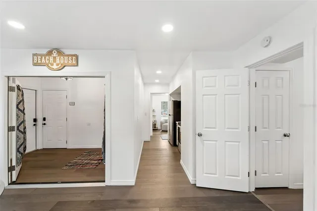 an aerial view of residential houses with outdoor space and mountain view