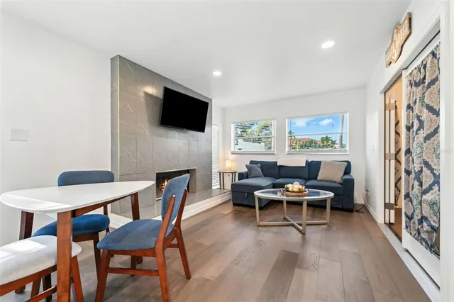 a view of a house with a big yard and large trees