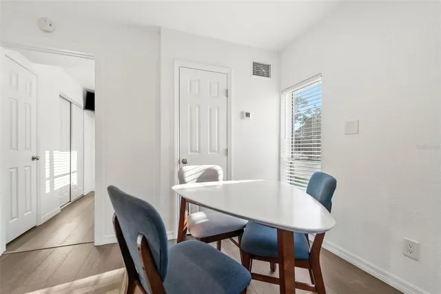 a house view with a garden and trees