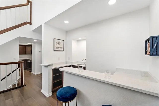 a kitchen with a sink and a refrigerator