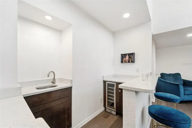 a kitchen with stainless steel appliances granite countertop a sink and stove top oven
