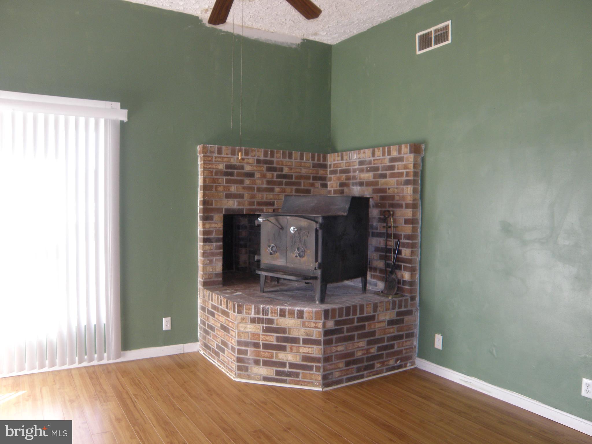 18206 McColleys Chapel Road Georgetown, DE 19947 - Photo 8 of 8 Wood Stove in Great/Living Room