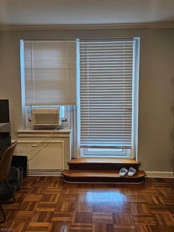 a kitchen with a window and cabinets
