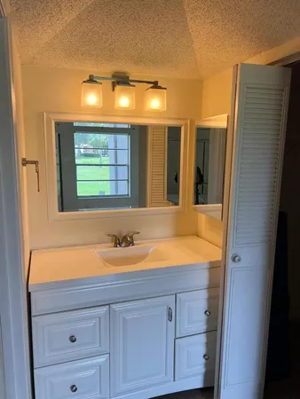 a view of room with ceiling fan and window