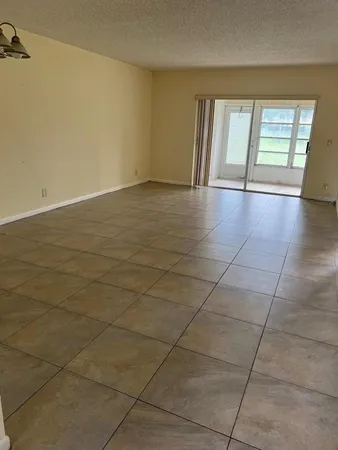 a view of hallway with windows and stairs