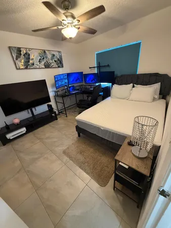 a bedroom with furniture and a chandelier