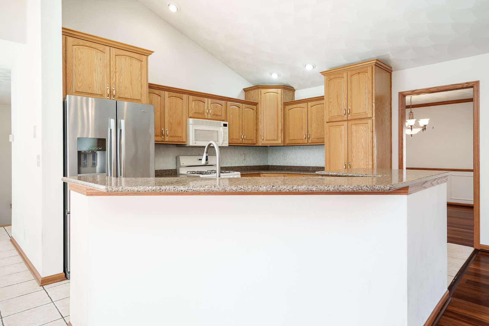 261 West Redtail Lane Oregon, IL 61061 - Photo 13 of 63 a kitchen with stainless steel appliances granite countertop a refrigerator and a sink