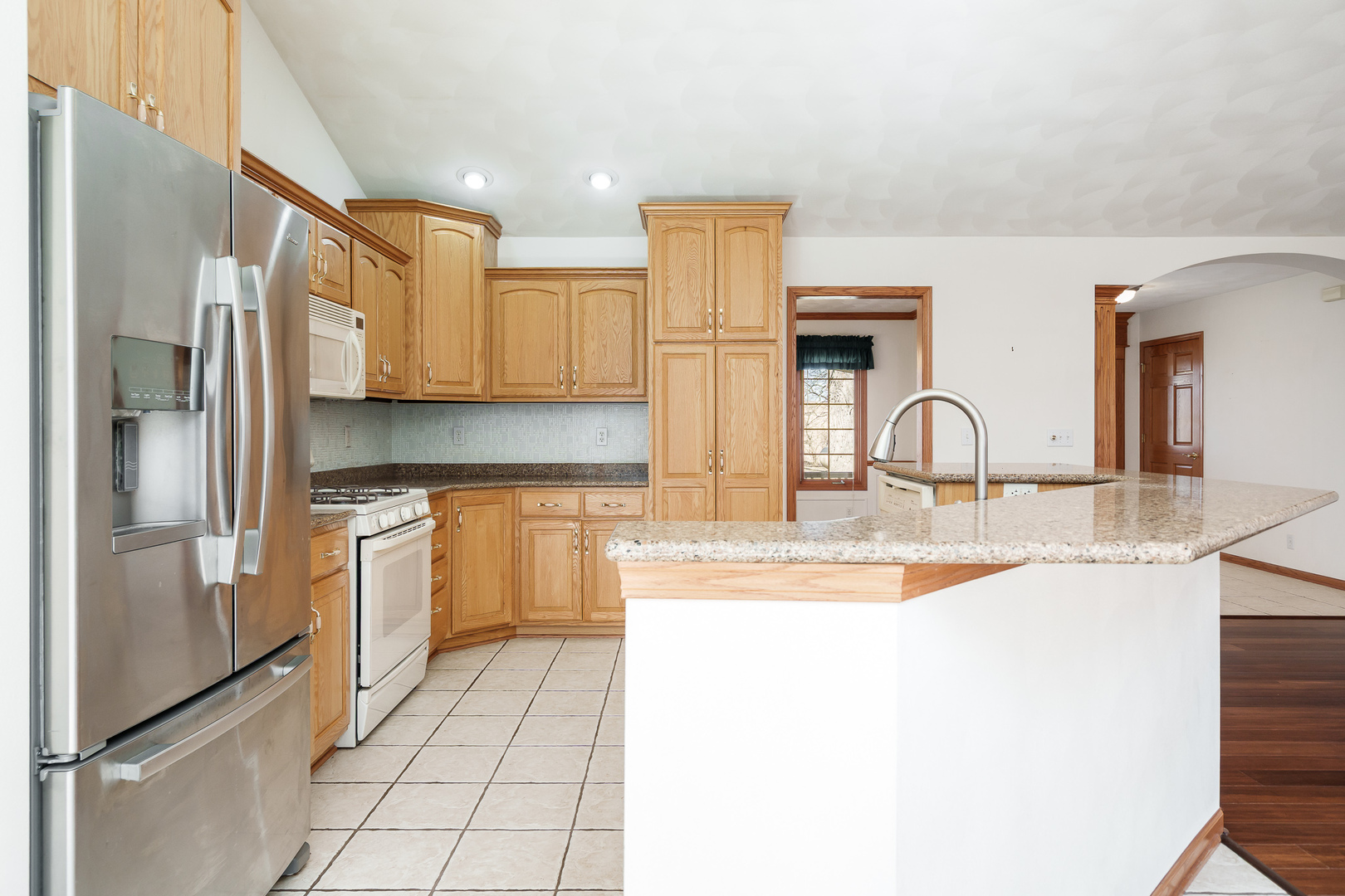 261 West Redtail Lane Oregon, IL 61061 - Photo 14 of 63 a kitchen with stainless steel appliances granite countertop a sink and a refrigerator