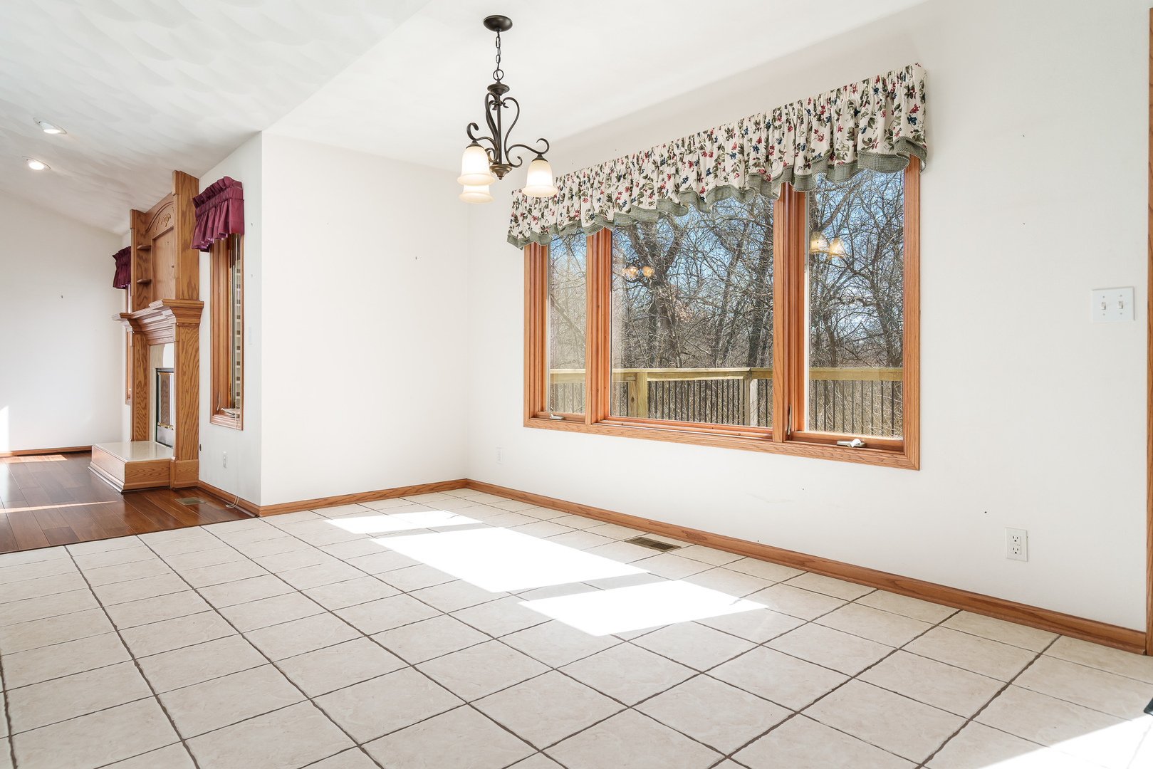 261 West Redtail Lane Oregon, IL 61061 - Photo 19 of 63 a view of an empty room with a window and chandelier