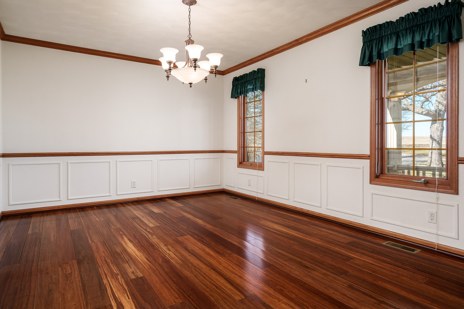 261 West Redtail Lane Oregon, IL 61061 - Photo 20 of 63 a view of an empty room with wooden floor and a window