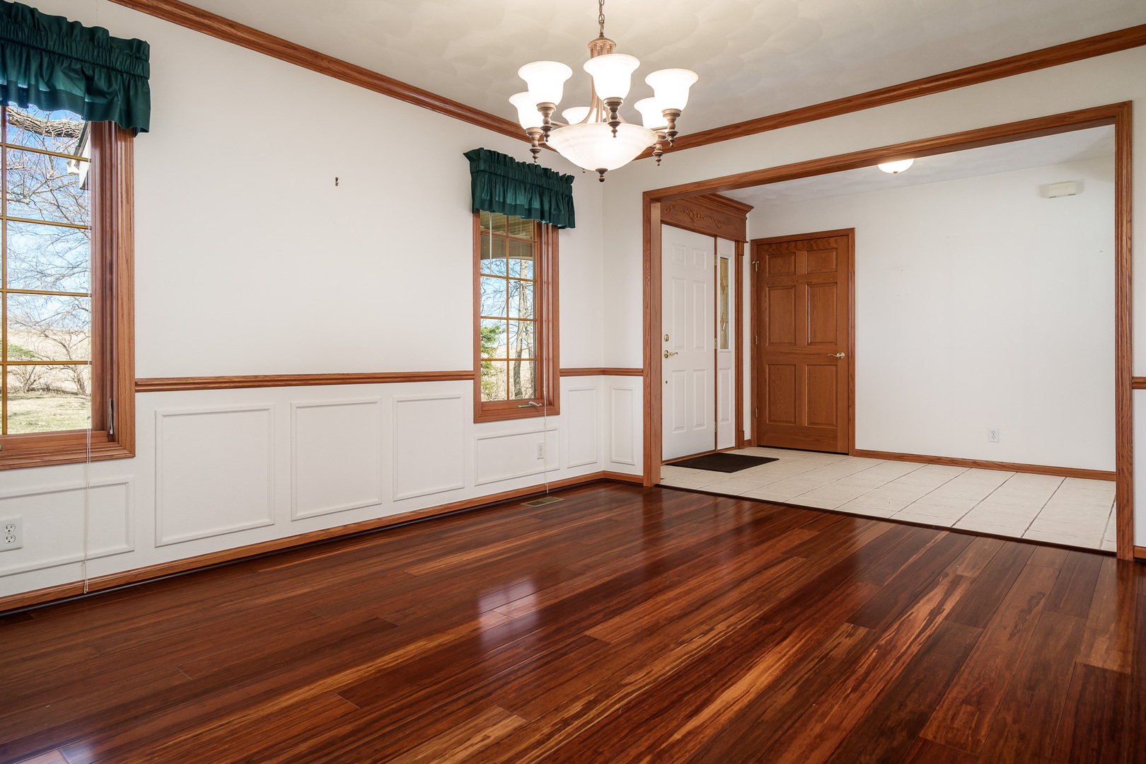 261 West Redtail Lane Oregon, IL 61061 - Photo 22 of 63 a view of an empty room with wooden floor and a window