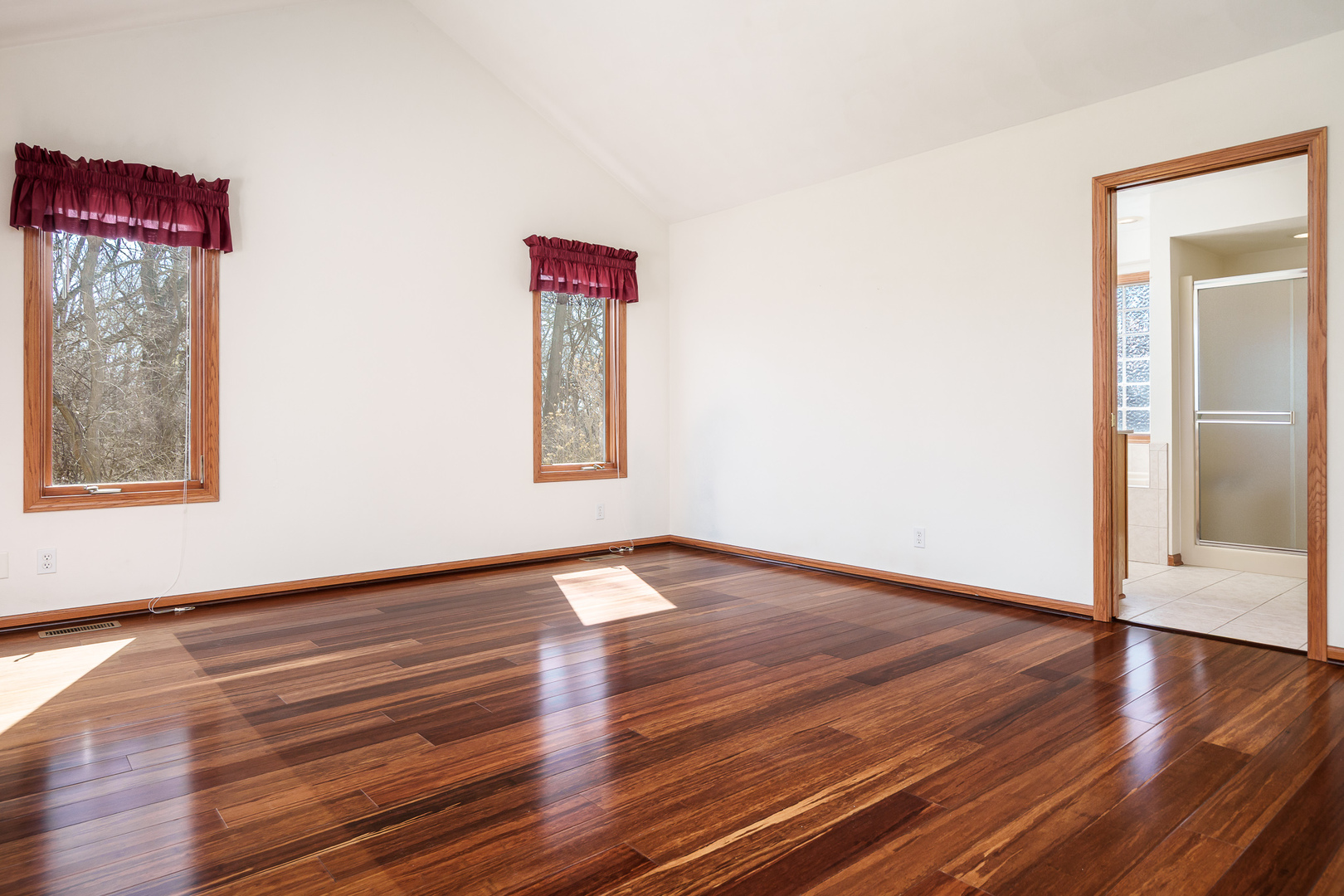 261 West Redtail Lane Oregon, IL 61061 - Photo 23 of 63 a view of an empty room with wooden floor and a window