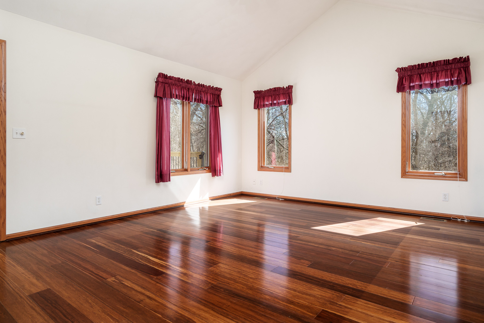 261 West Redtail Lane Oregon, IL 61061 - Photo 24 of 63 a view of an empty room with window and wooden floor