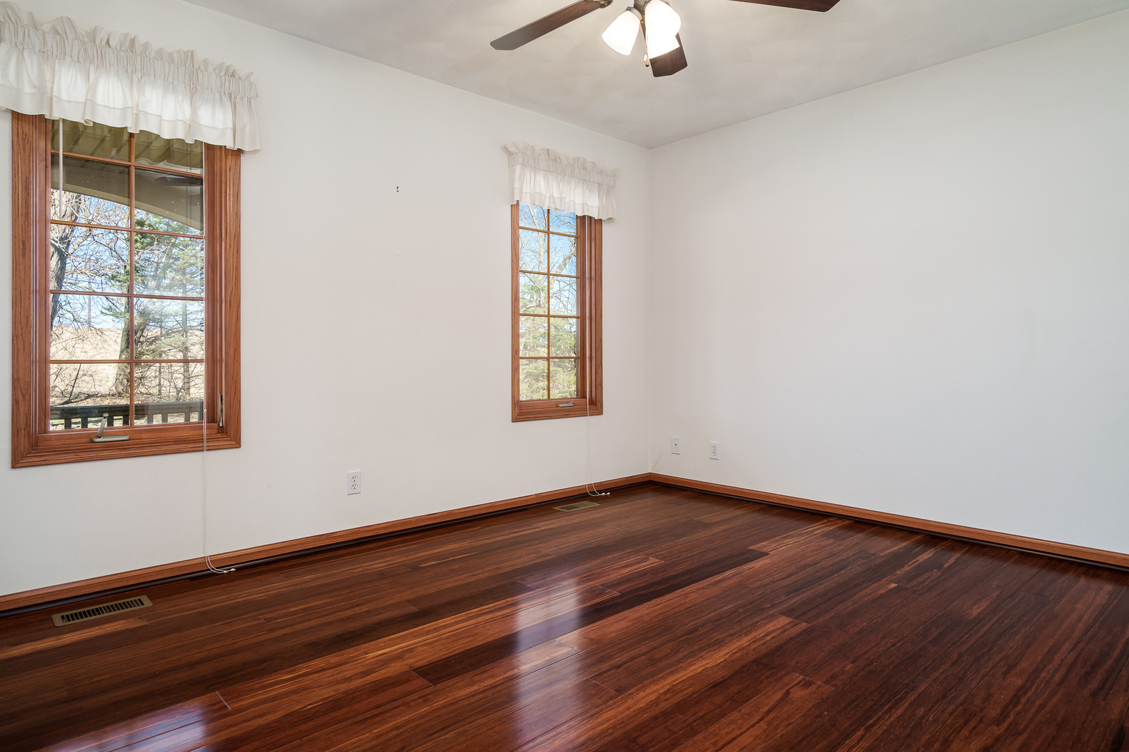 261 West Redtail Lane Oregon, IL 61061 - Photo 33 of 63 a view of an empty room with wooden floor and a window