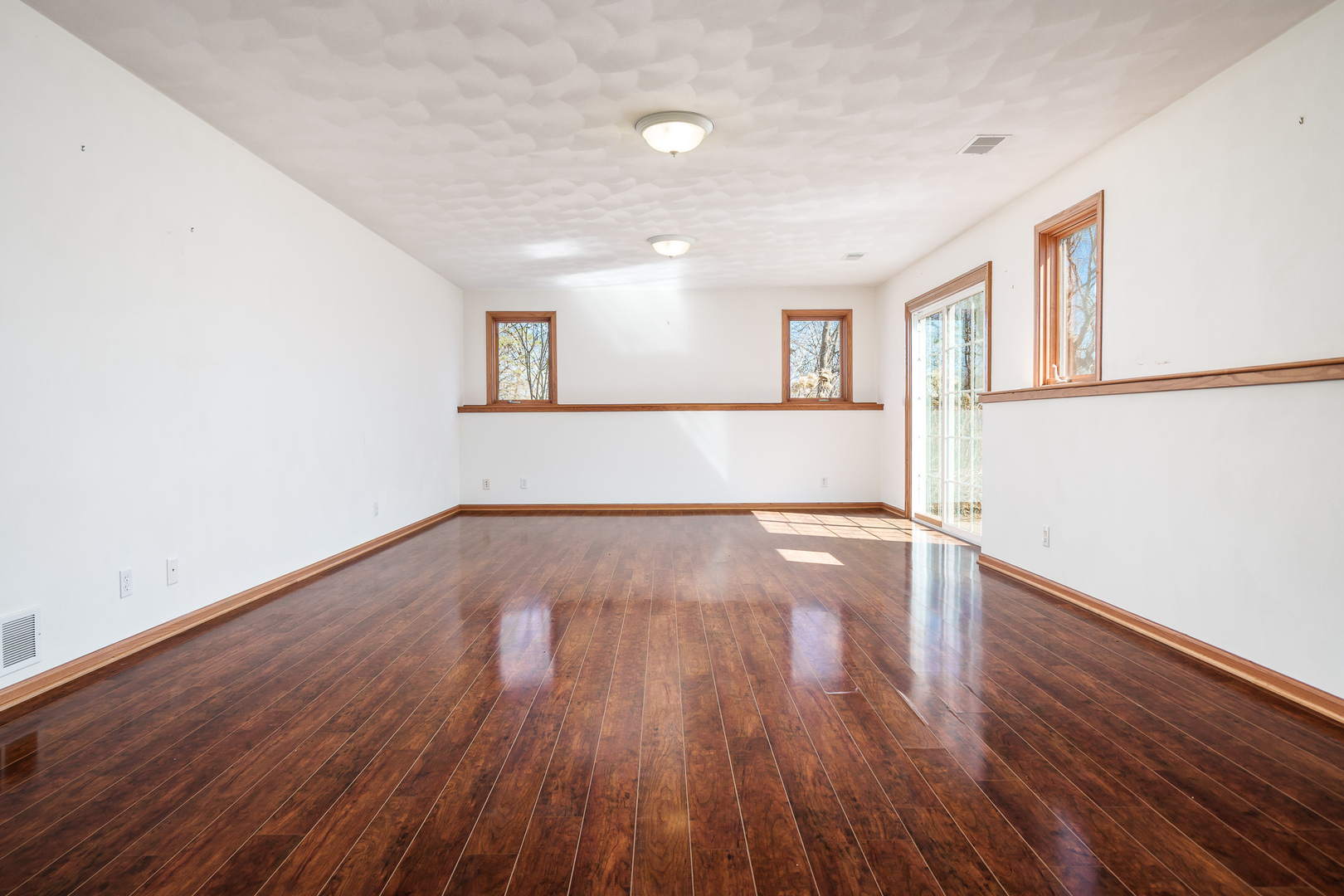 261 West Redtail Lane Oregon, IL 61061 - Photo 41 of 63 a view of empty room with wooden floor and fan