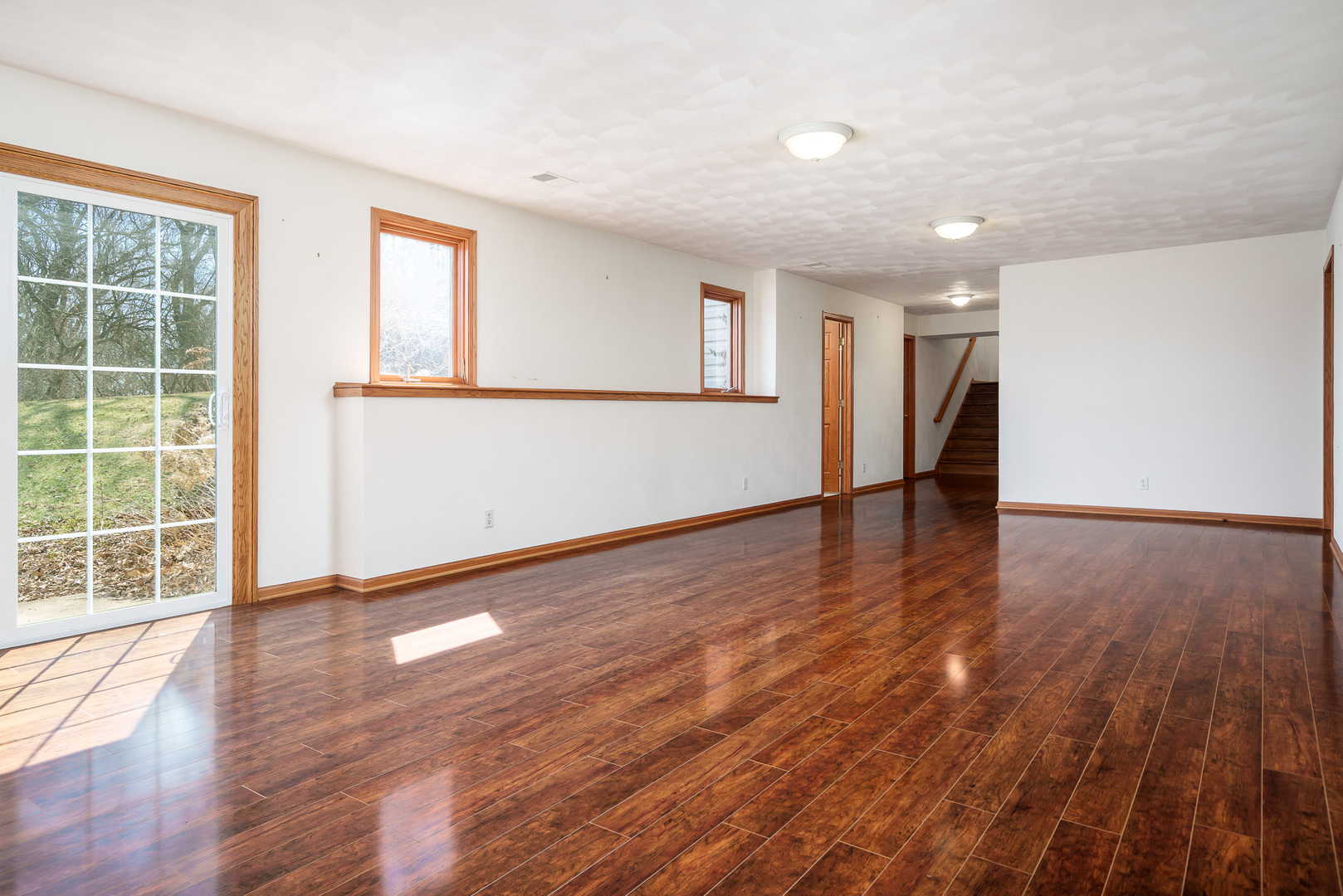 261 West Redtail Lane Oregon, IL 61061 - Photo 43 of 63 a view of empty room with wooden floor and fan
