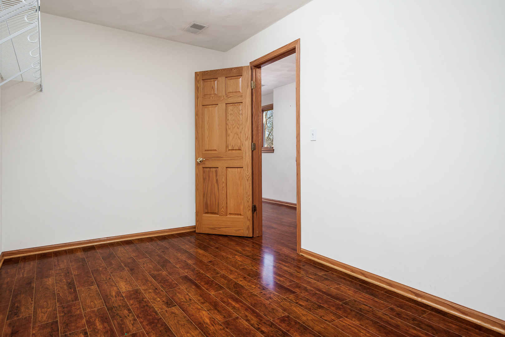 261 West Redtail Lane Oregon, IL 61061 - Photo 48 of 63 a view of an empty room with wooden floor