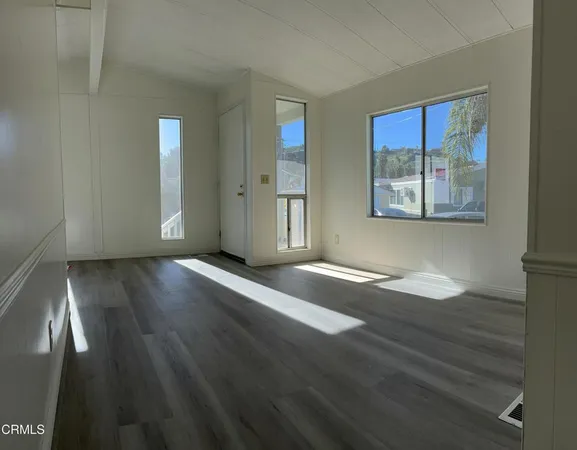 a kitchen with white cabinets and a sink